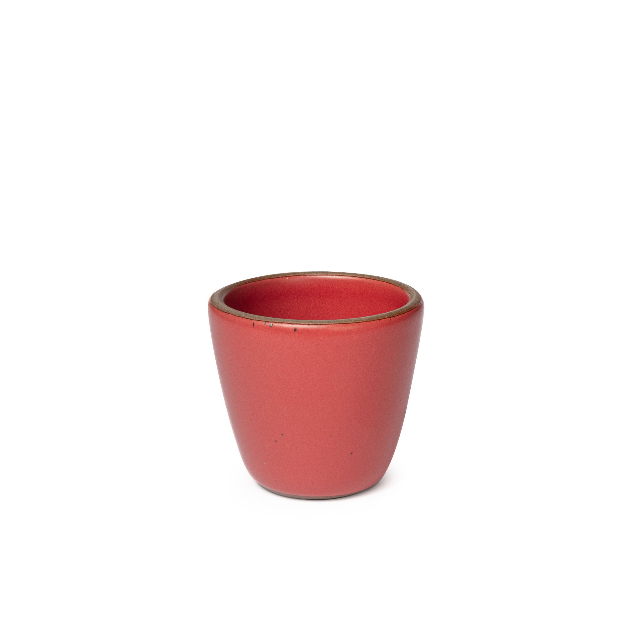A short cup that tapers out to get wider at the top in a bold red color featuring iron speckles