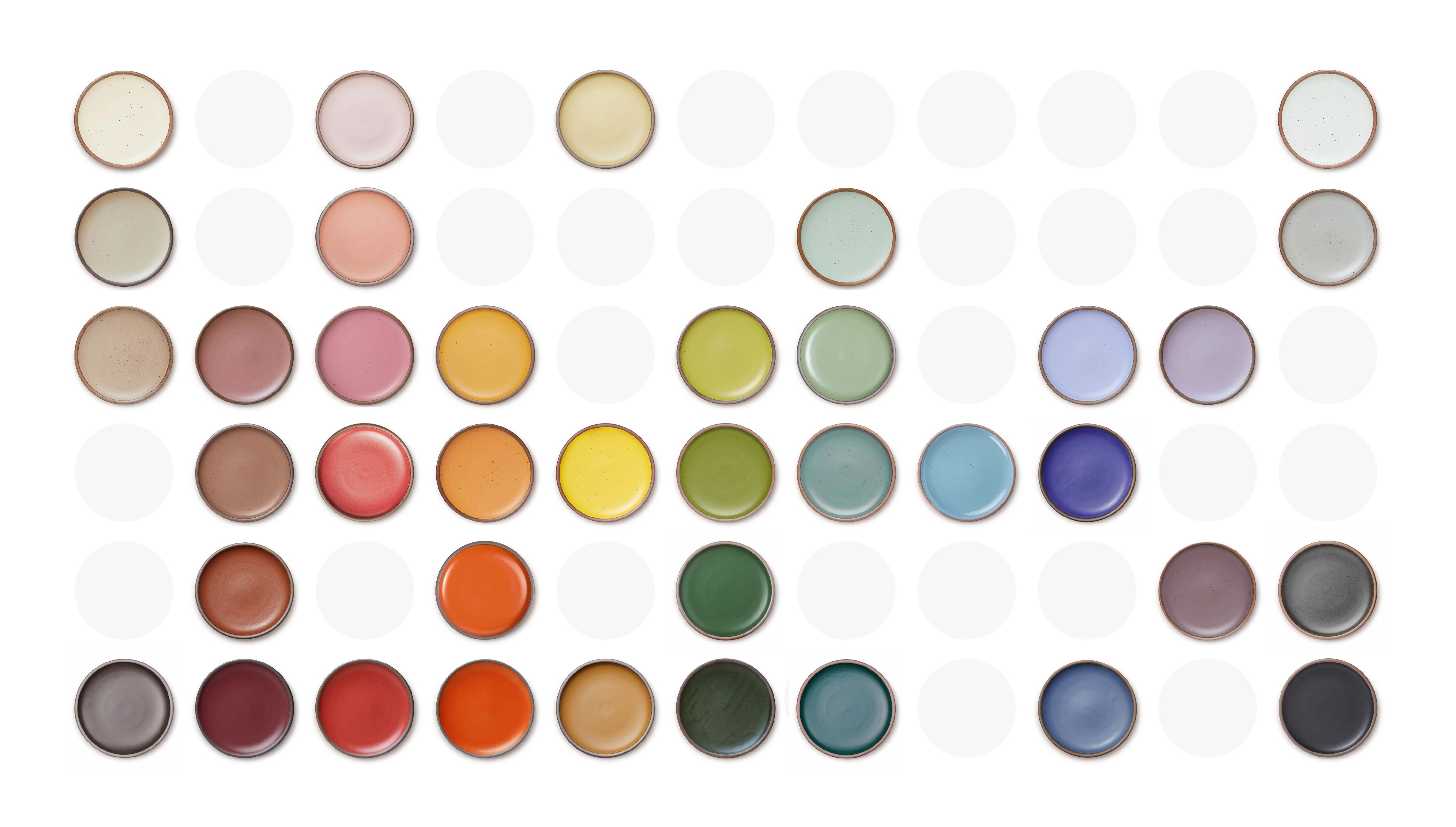 A graphic of a grid of ceramic plates laid out and arranged by color. 