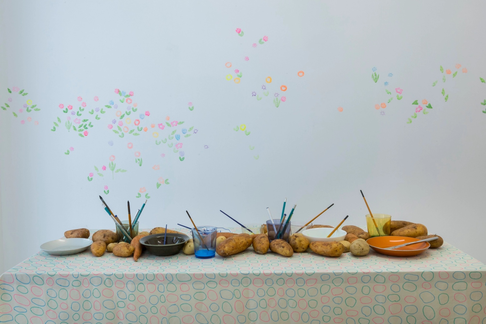 Slide 12/28: Darko Aleksovski, A Tablescape Between Roots and Flowers, mixed-media installation, dimensions variable. Photo by Nefeli Papaioannou. 