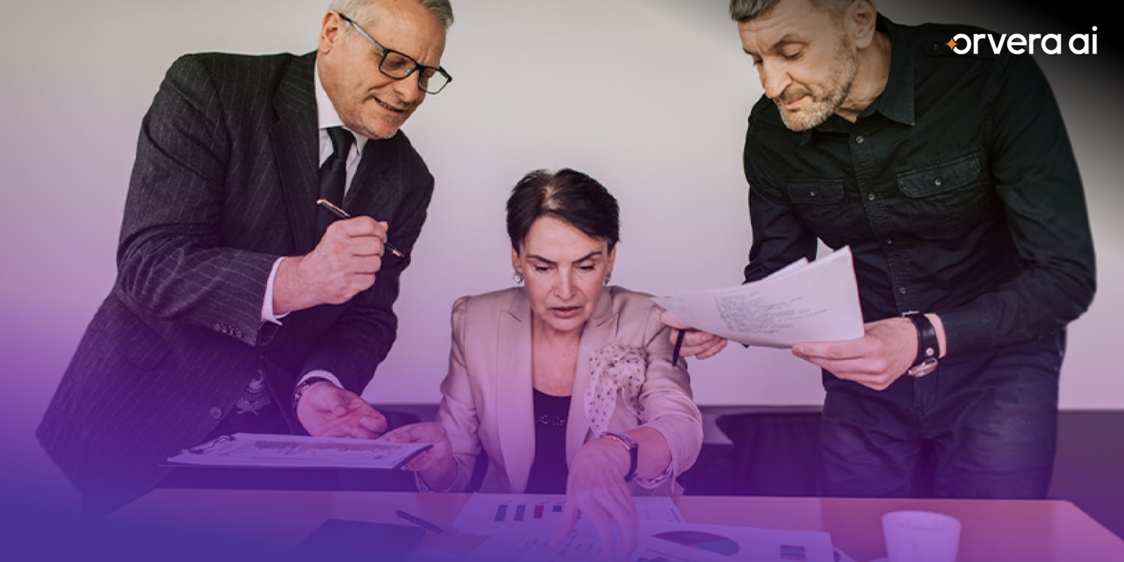 Orvera image showing business leaders reviewing documents, representing enterprise AI planning, governance, and deployment decisions.