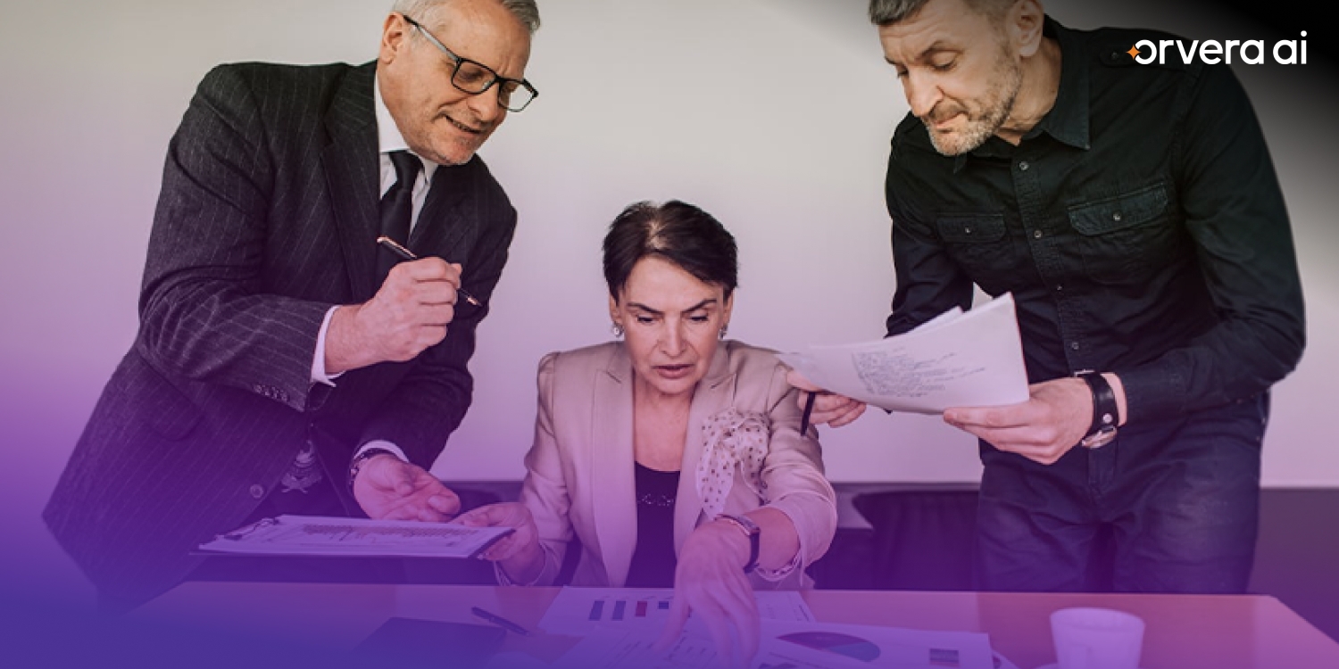 Orvera image showing business leaders reviewing documents, representing enterprise AI planning, governance, and deployment decisions.