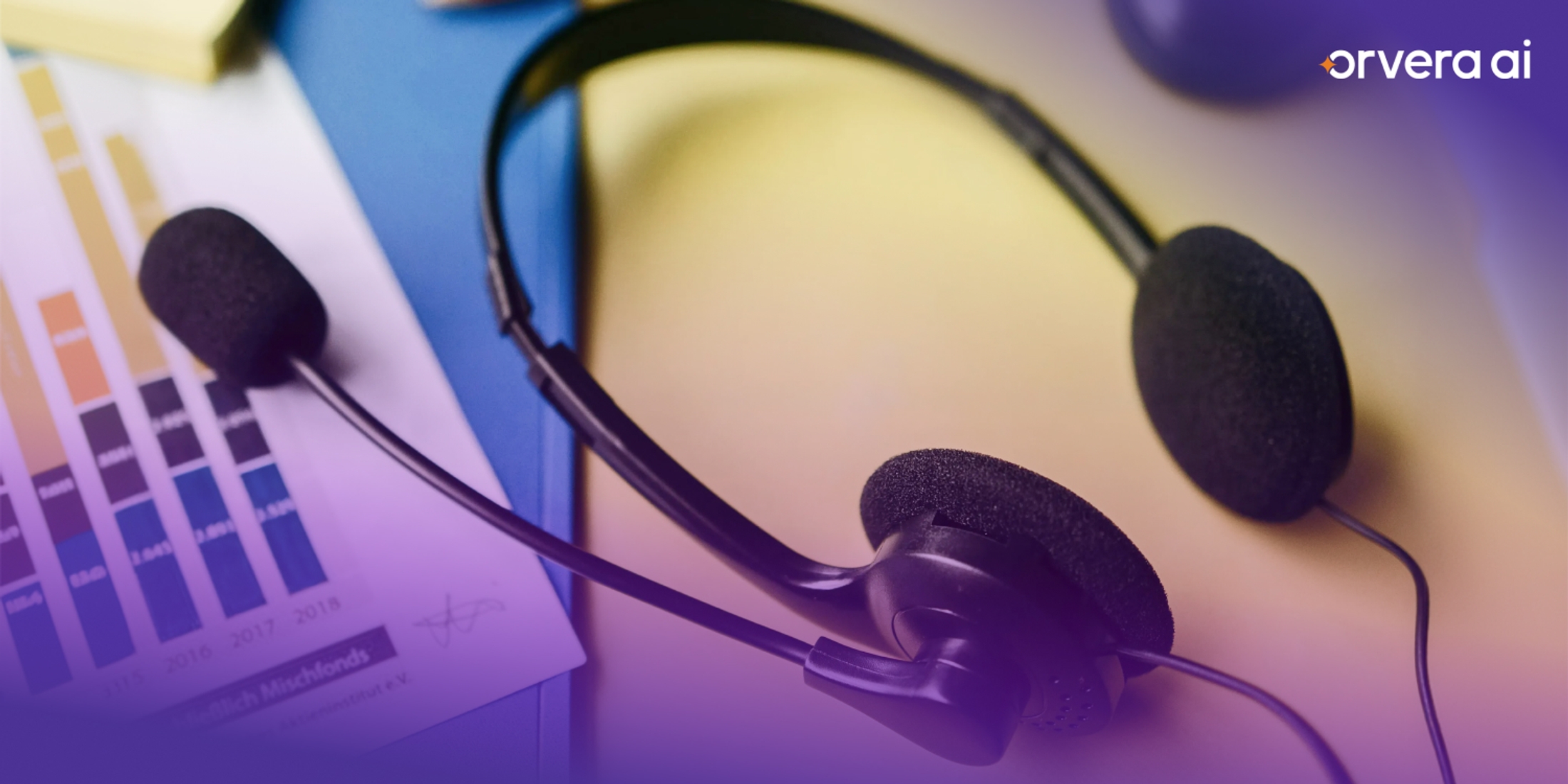 Close-up of a customer service headset placed beside business reports, representing inbound call handling, support operations, and contact center communication.
