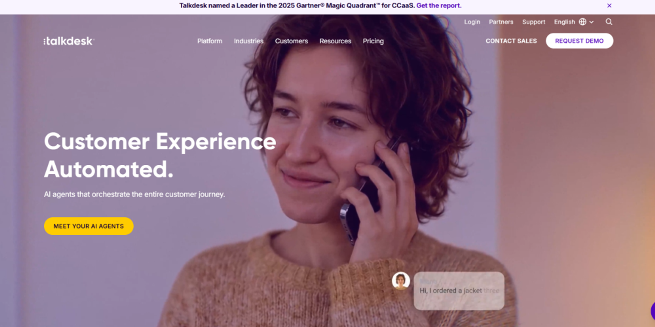 Talkdesk homepage highlighting AI agents that automate customer journeys, with enterprise contact center solutions and CX automation.
