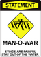 A sign with bold, red lettering at the top that says "Statement" under which iconography depicts a swimmer surrounded by jellyfish. Under the iconography, text says: "Man-o-war. Stings are painful, stay out of the water."