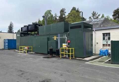nullSide view of containerised Himoinsa/Siemens HGS-810 T5 CHP with access doors – 812kW industrial gas genset for sale