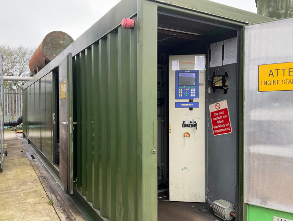 nullPhoto from exterior of Jenbacher 320 Container, showing part of inside, including control panel. 