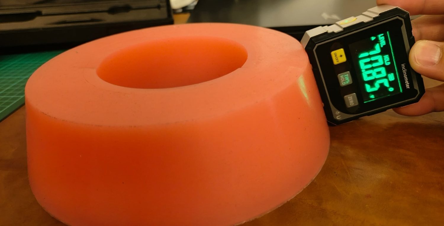 Custom silicone rubber component undergoing dimensional inspection