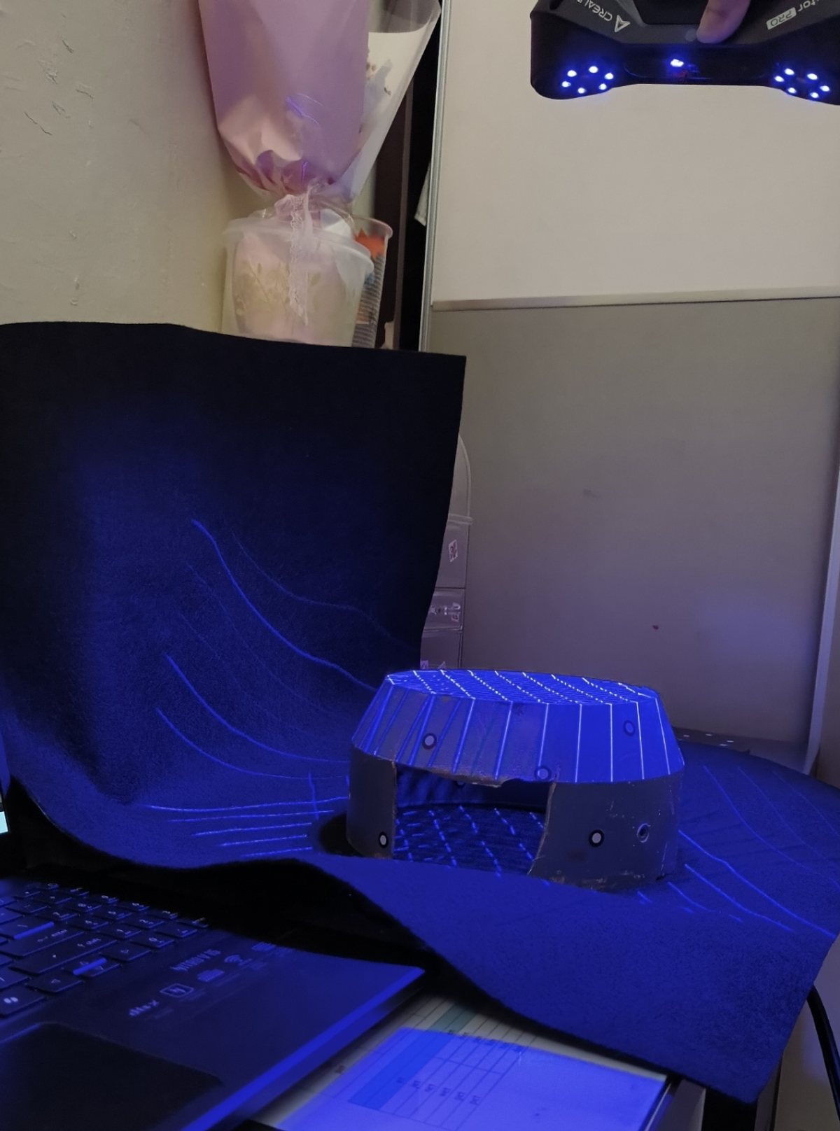 Existing motor cover being captured with a marker-assisted handheld scanner