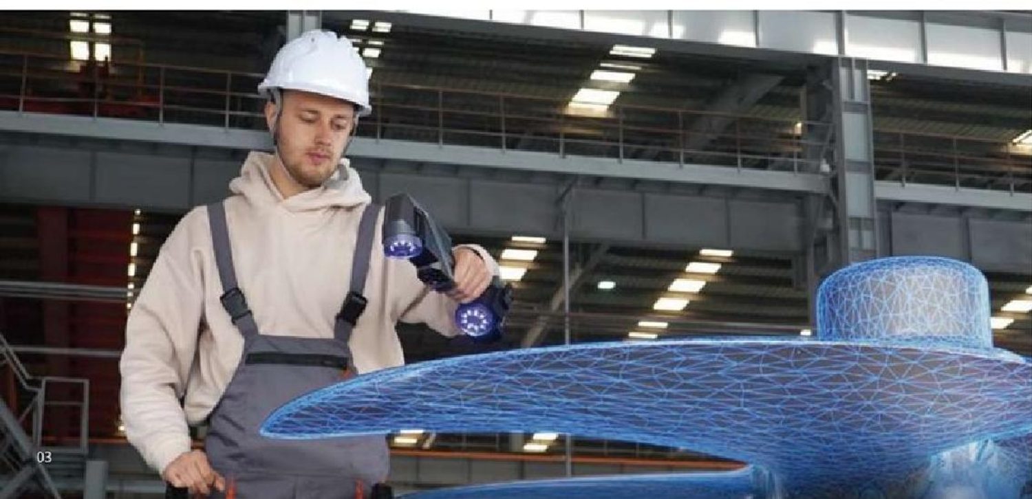 Technician using a handheld 3D scanner on a large industrial component