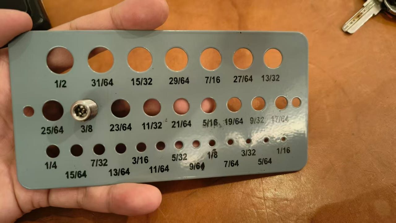 Ball plunger sample shown against an imperial size reference board