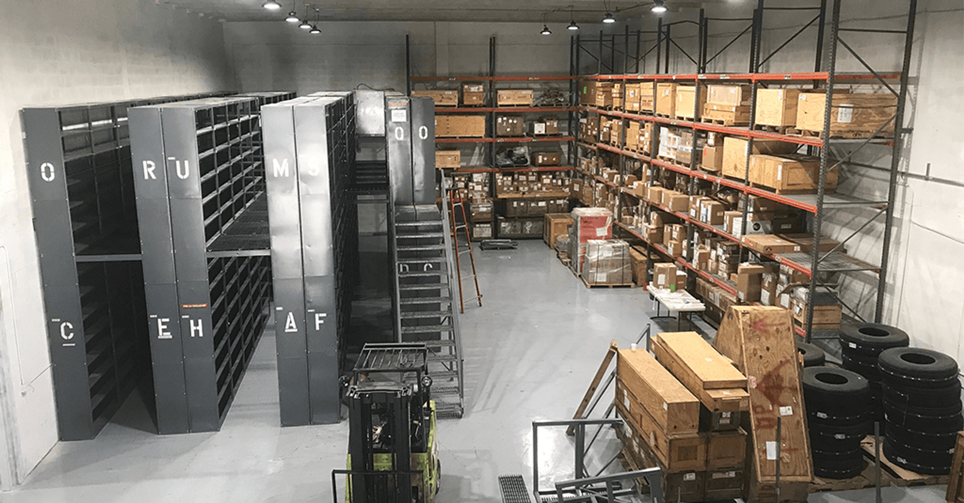 Light gray epoxy floor in a parts warehouse with shelving