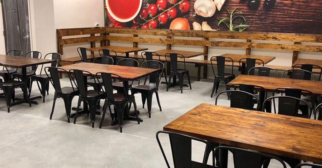 Polished concrete floor in a restaurant dining room with wood tables