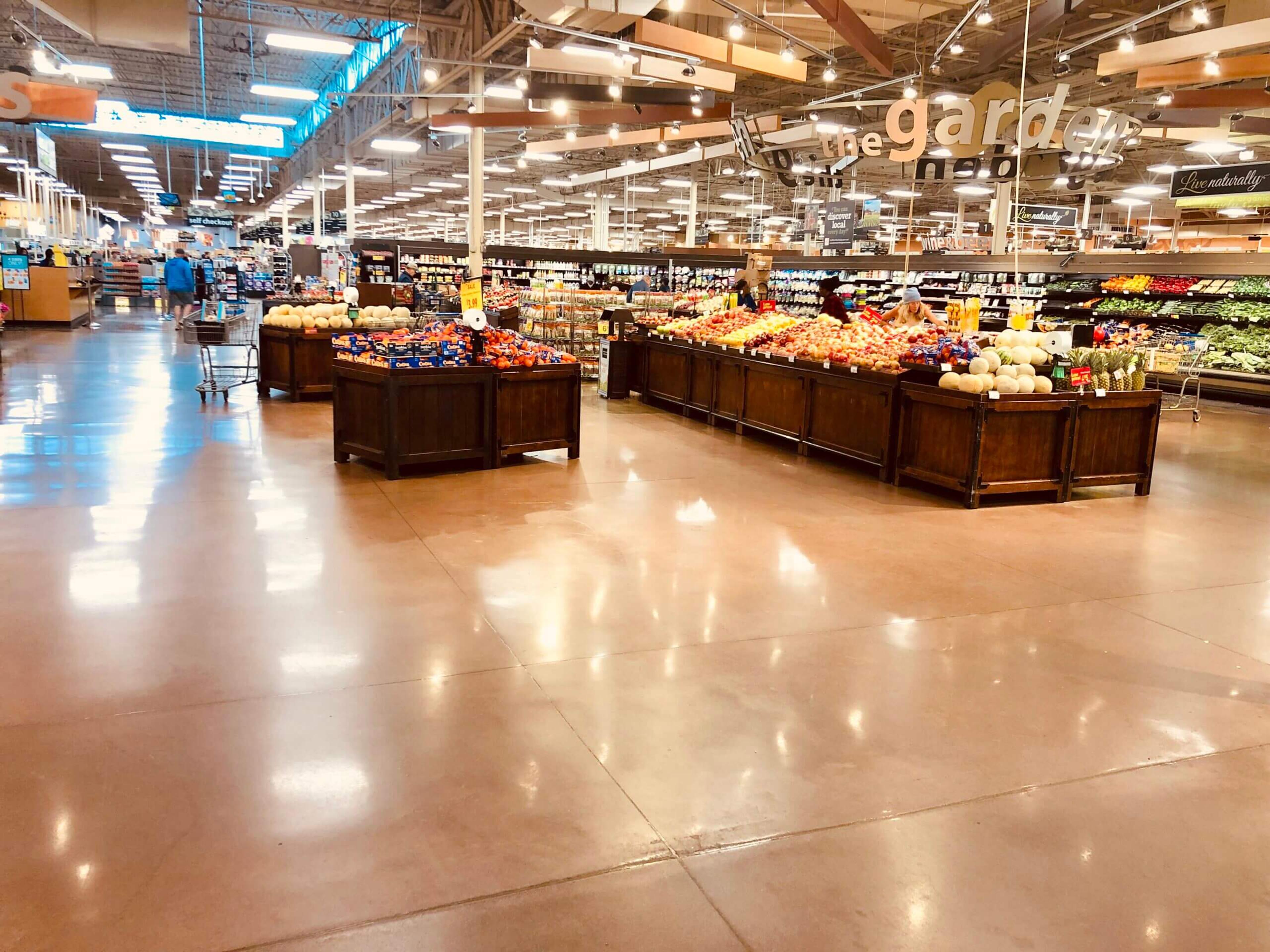 Polished stained concrete floor in a grocery store produce section