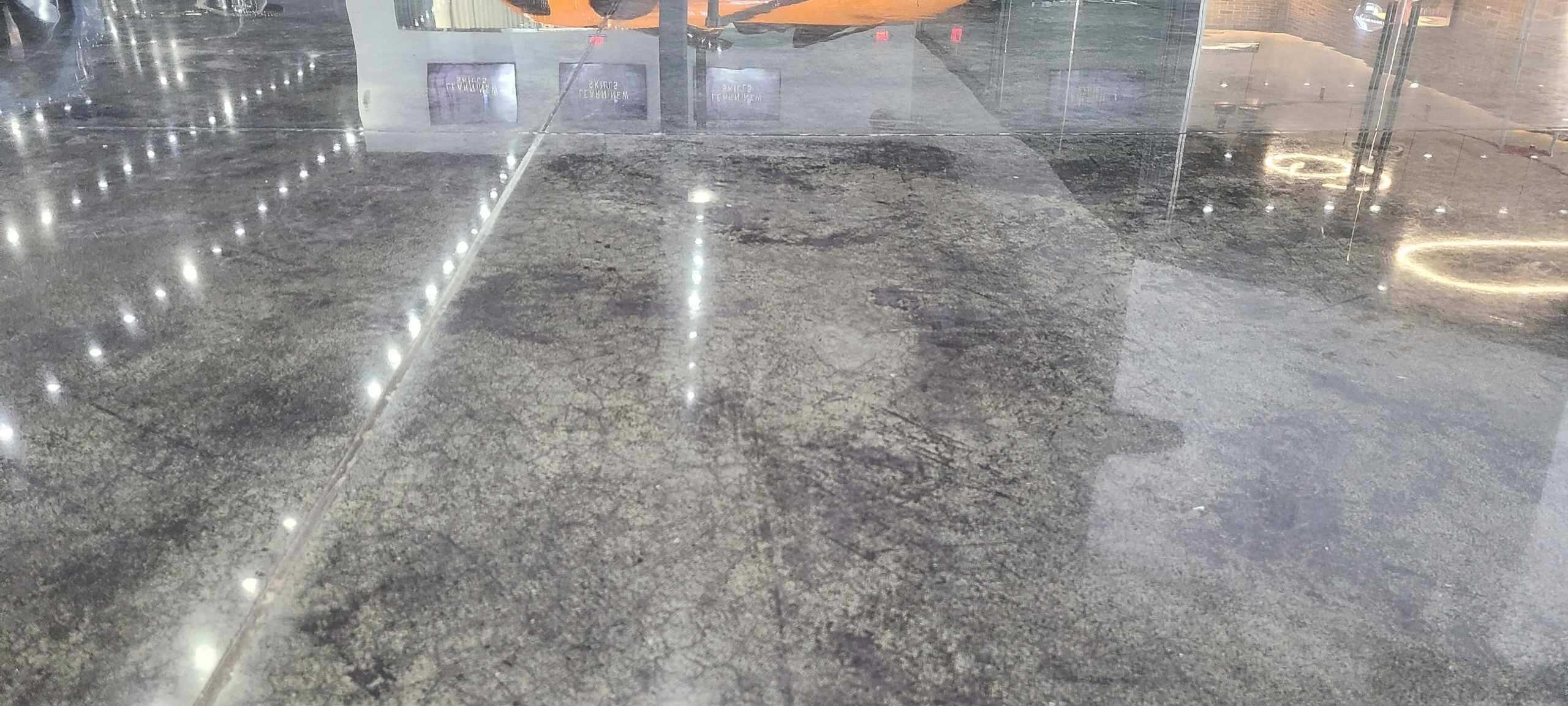 Gray and white stained concrete floor with a mottled finish