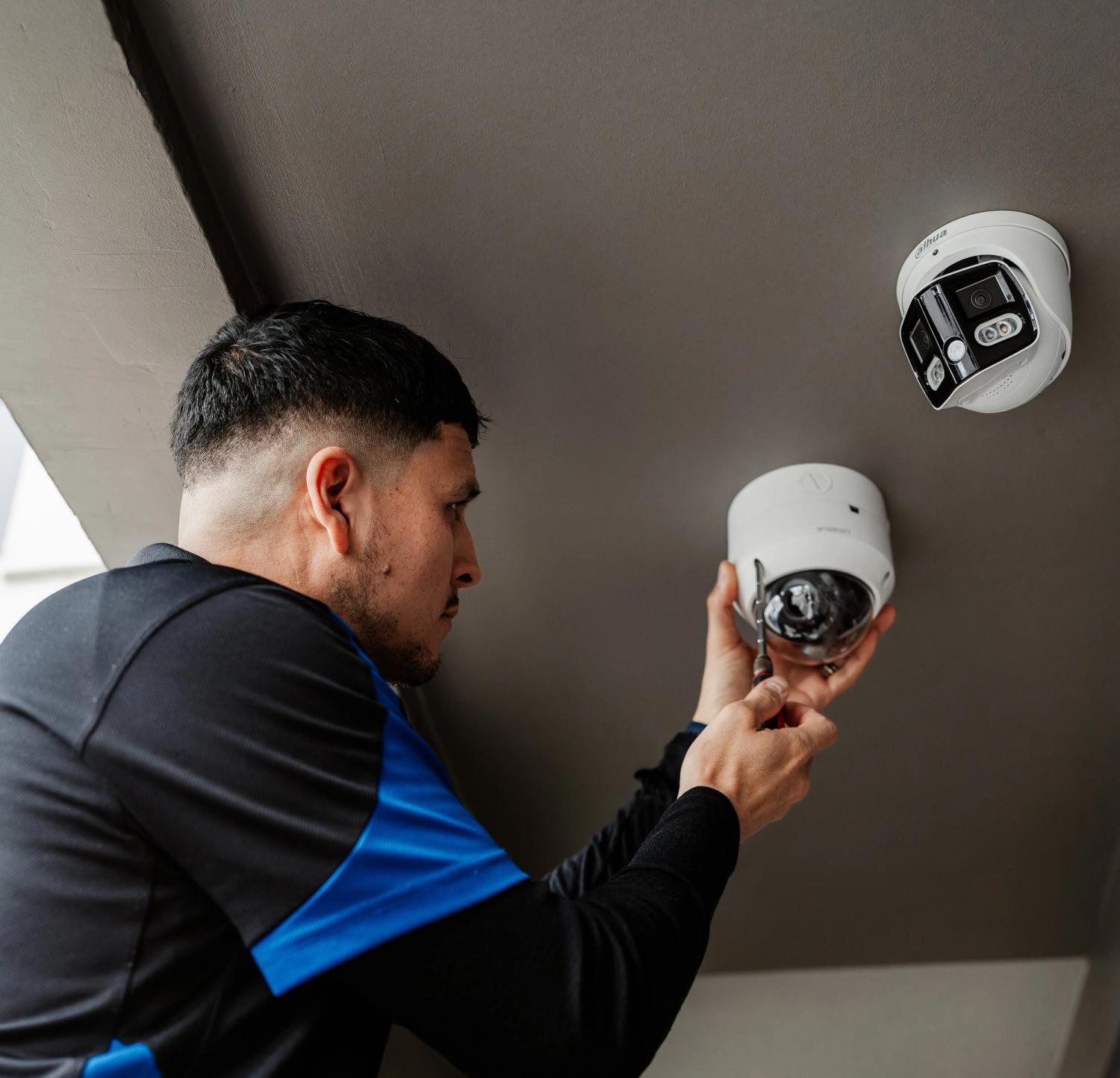 Tech installing cameras