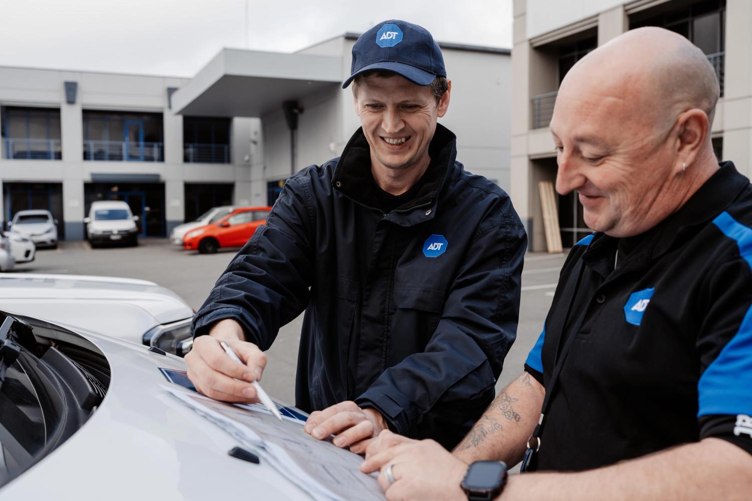ADT employees looking at site plans