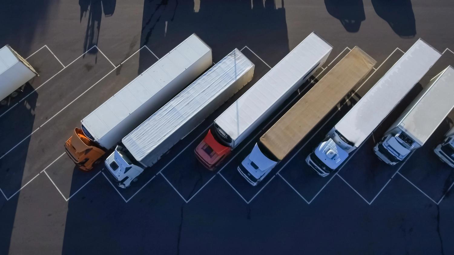 aerial shot of large coloured trucks  