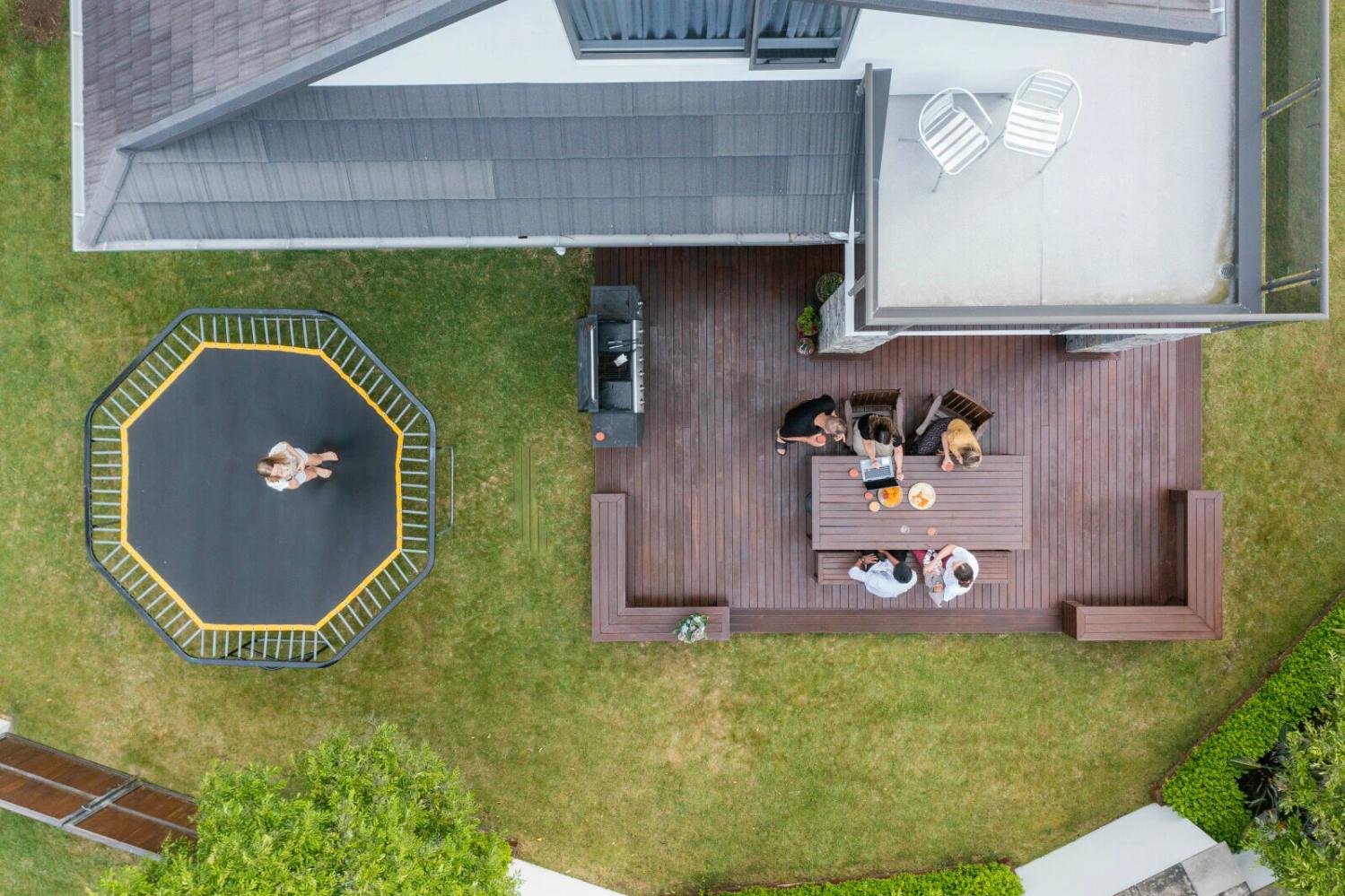 Friends sitting on deck socialising