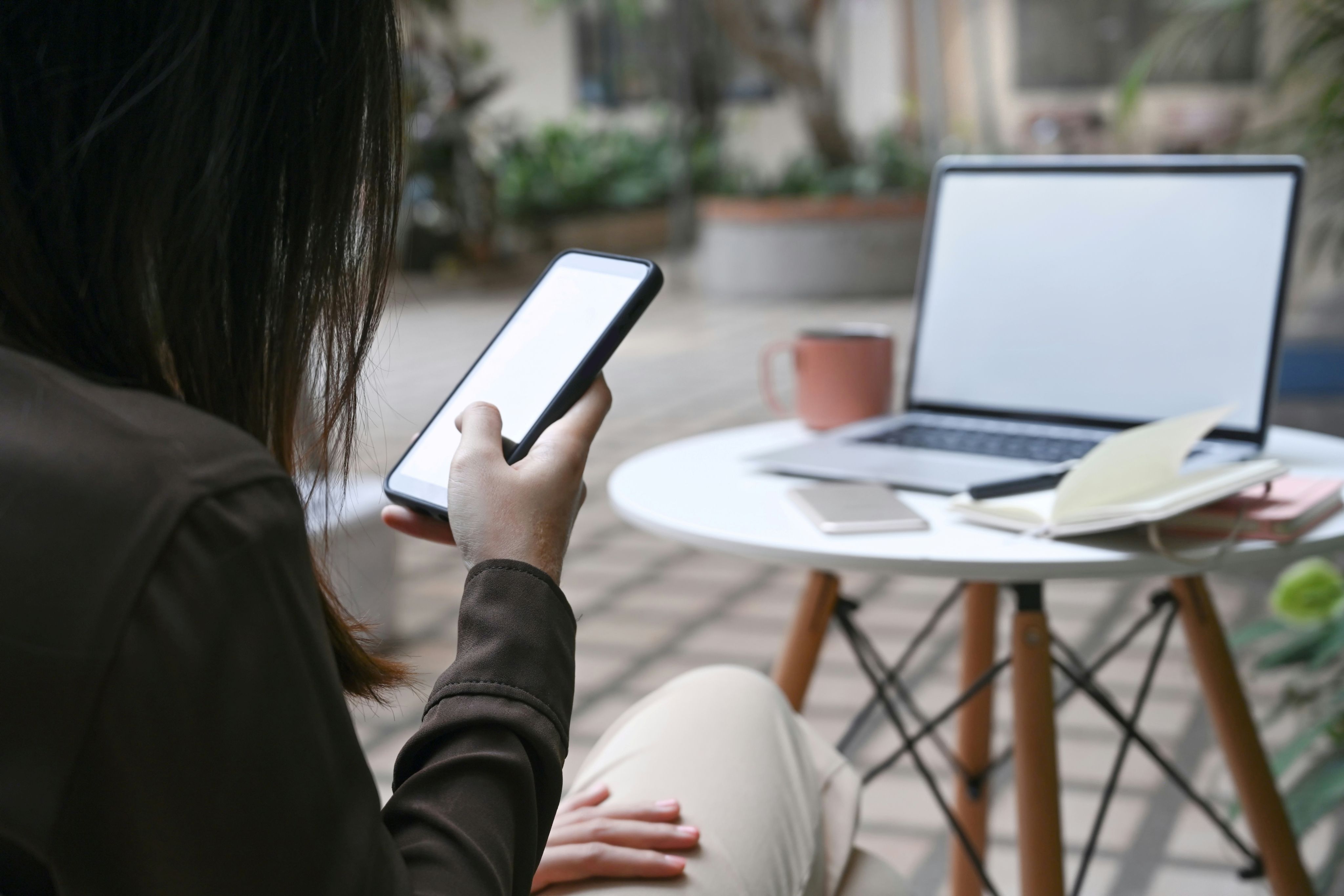 Woman looking at her security app on phone