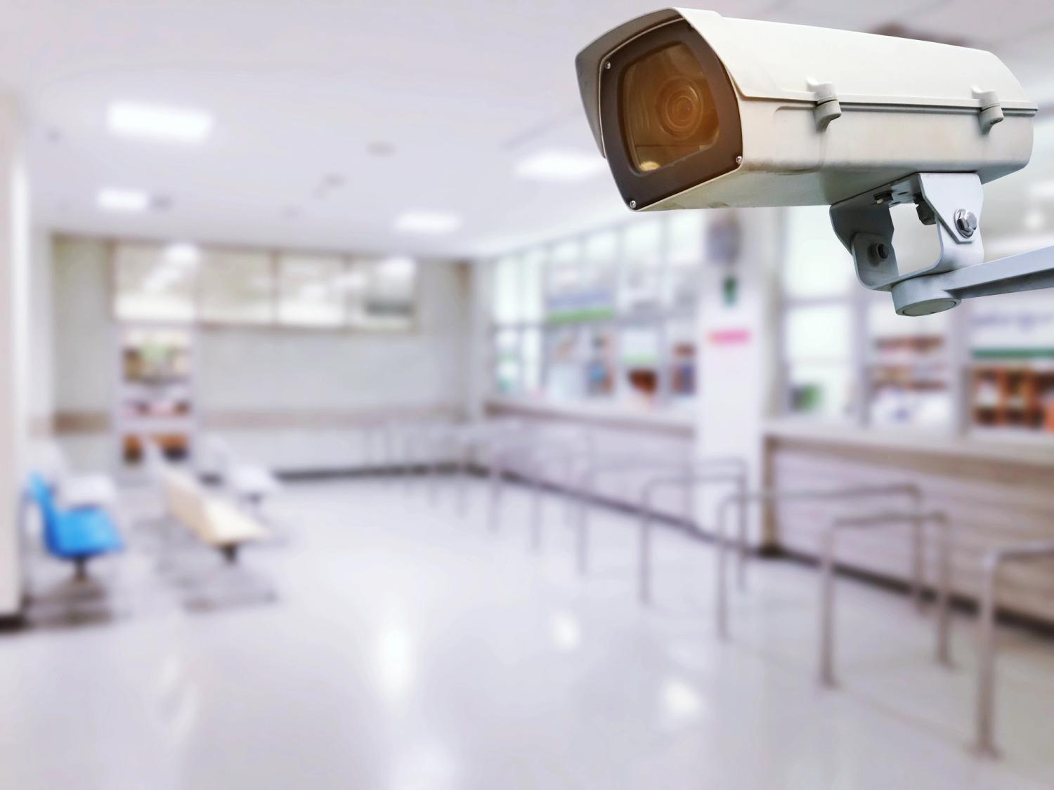 Close-up of a camera, with a blurred background of a health centre