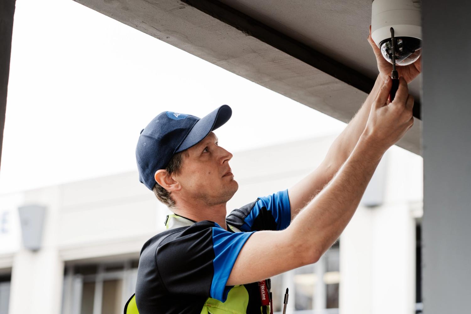 ADT technician working on camera