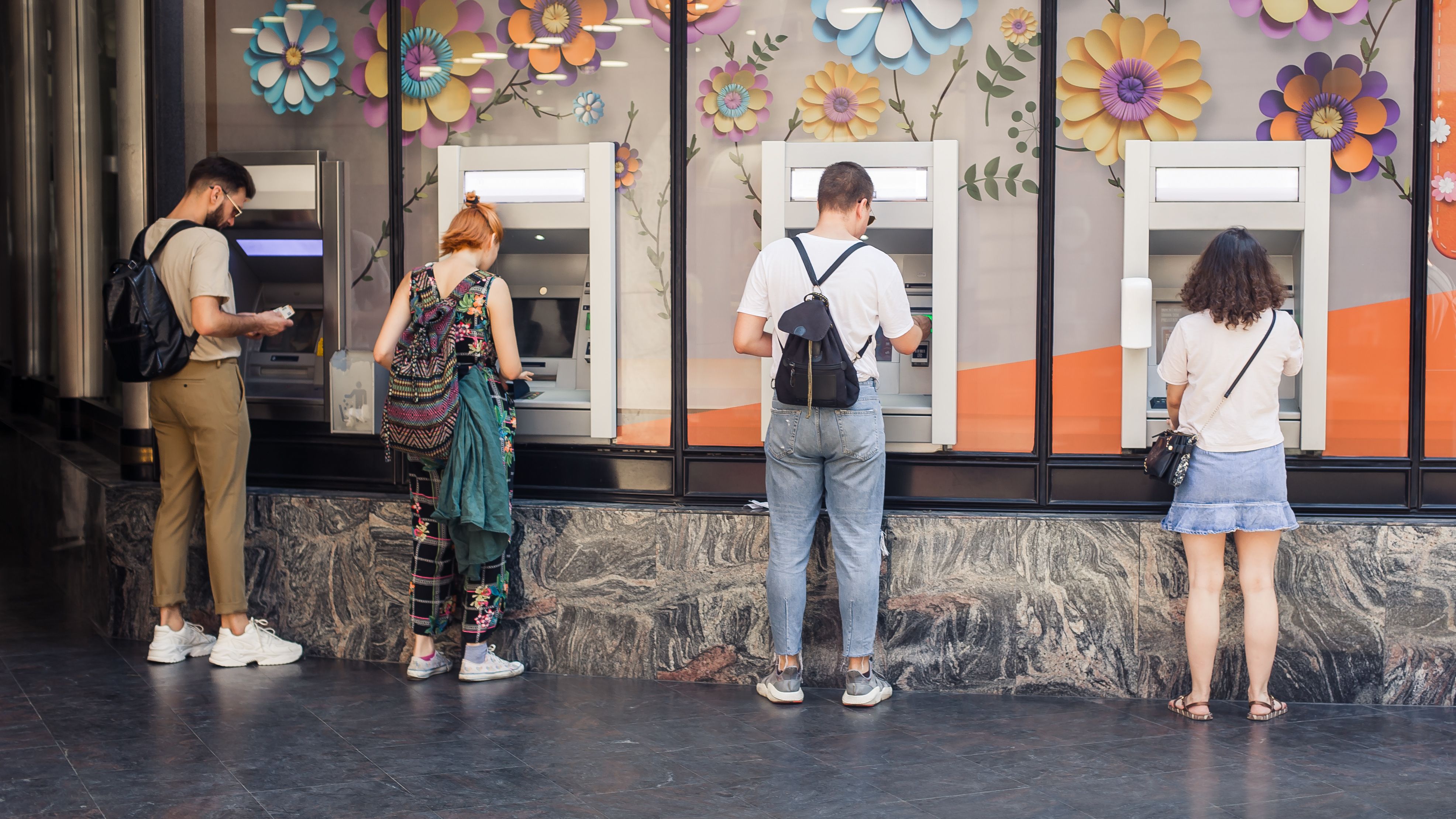 people queuing at atm
