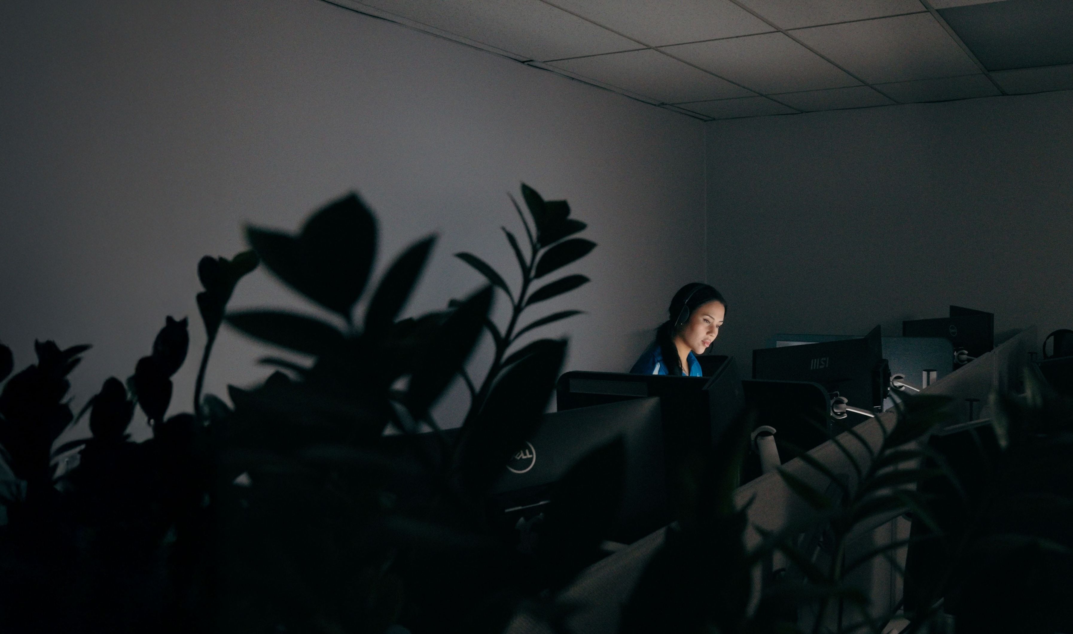 ADT staff member watching a security feed at night