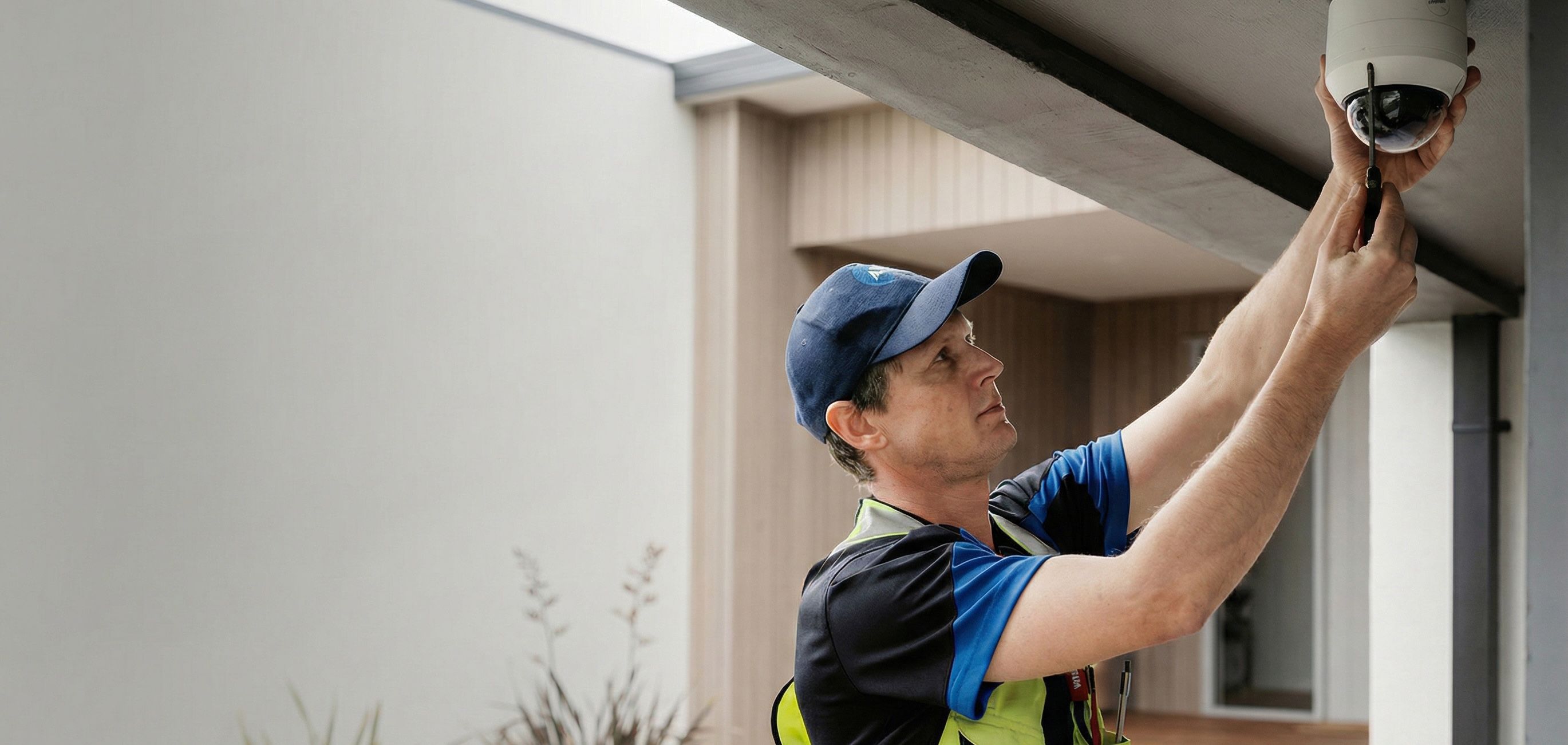 AI image: ADT technician installing camera