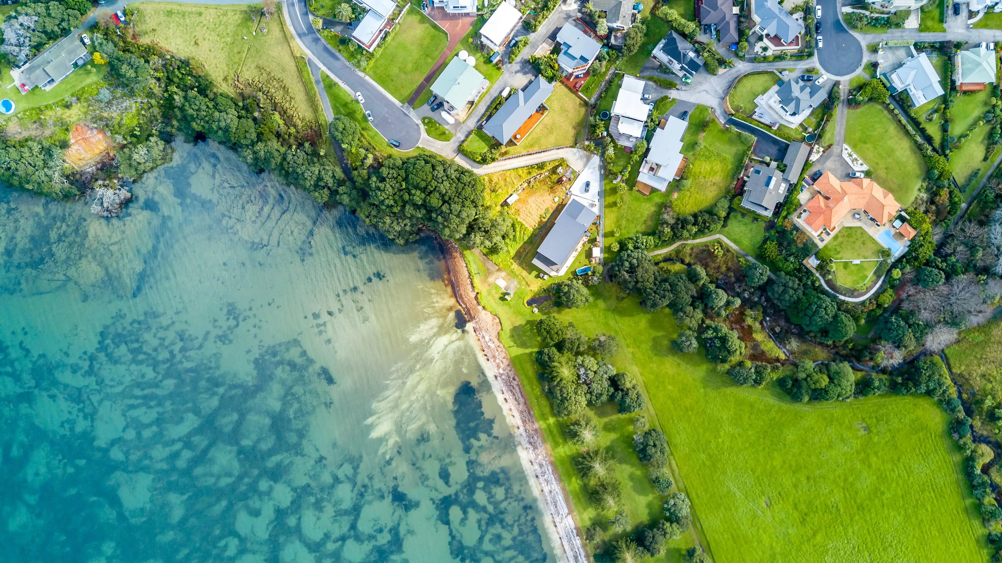 Aerial view of homes by the ocean