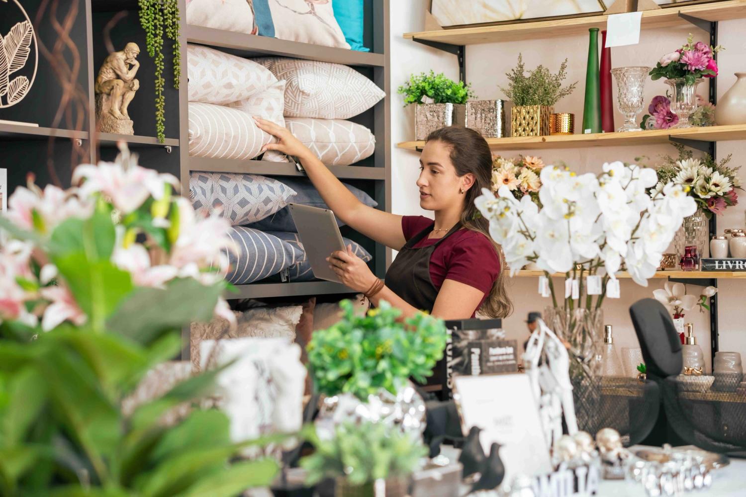 Woman working in homewares store