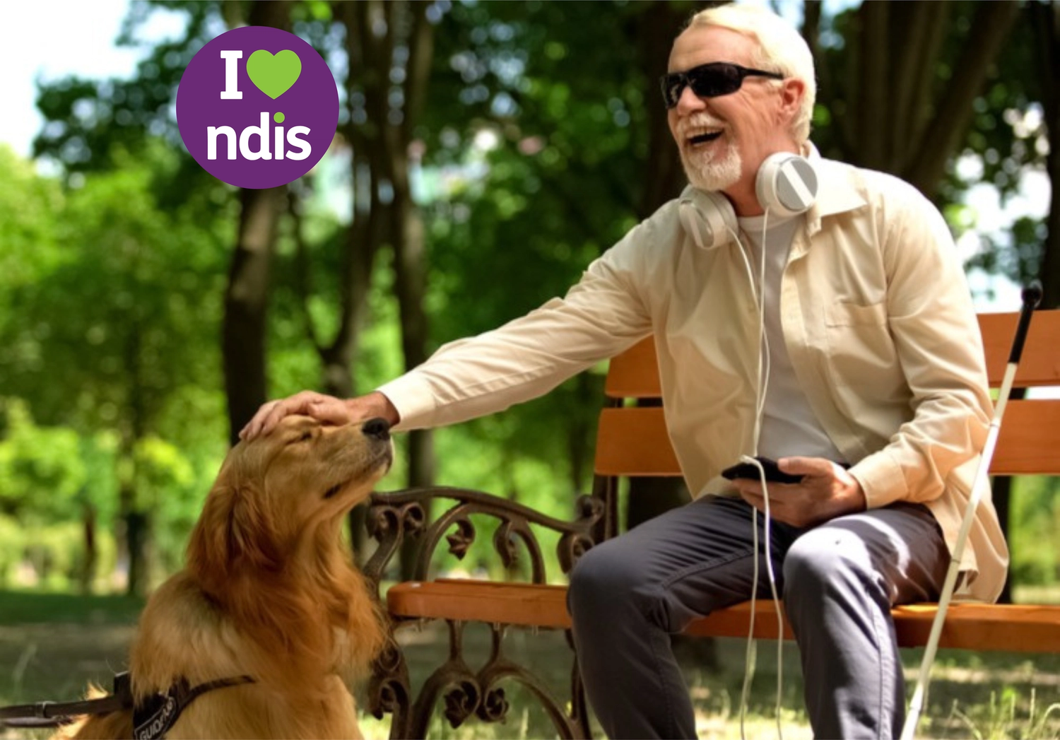 Man in wheelchair with dog and NDIS logo.