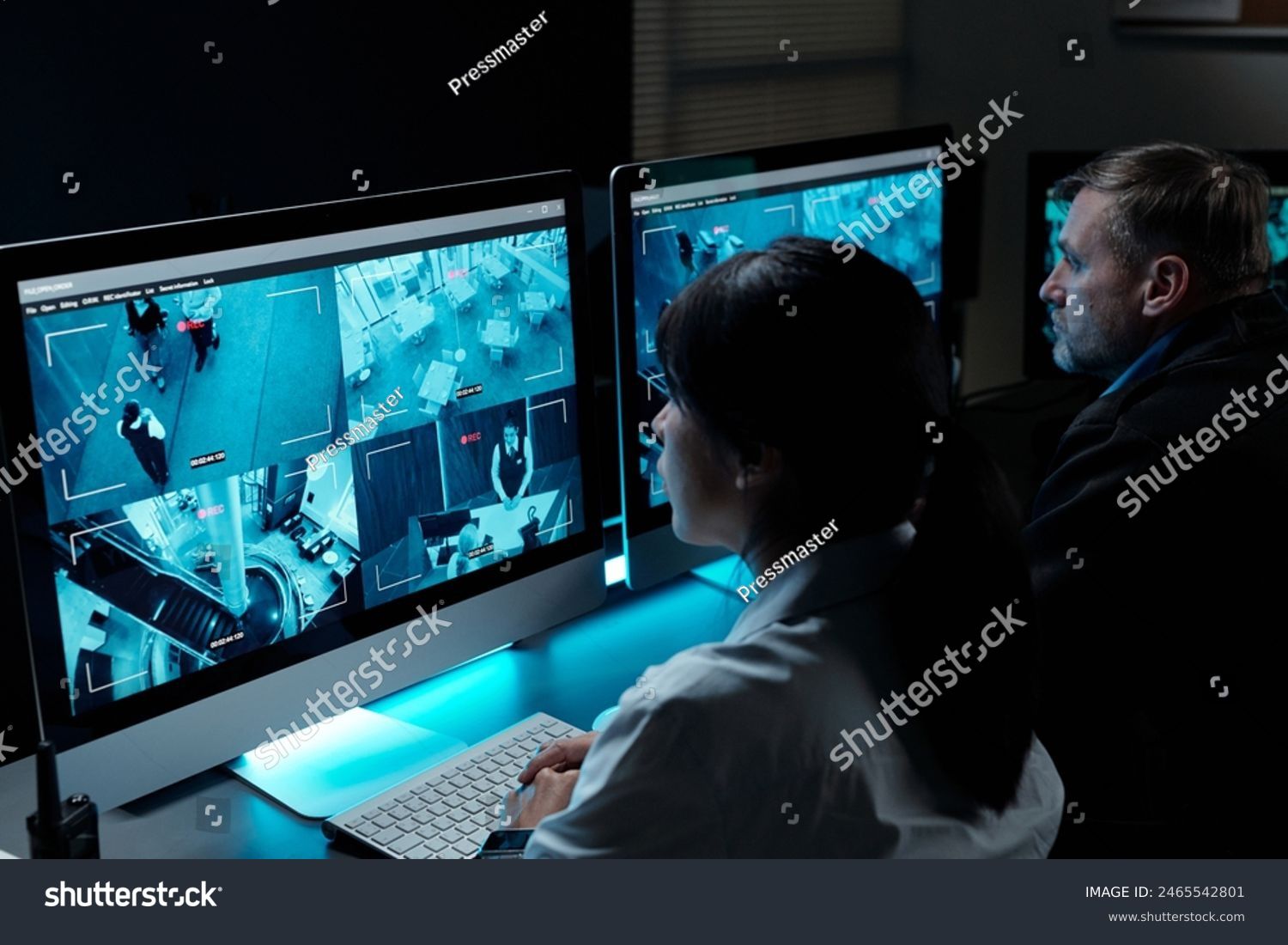 Smiling IT Specialist Using Tablet Computer in Data Center, Looking at Camera.