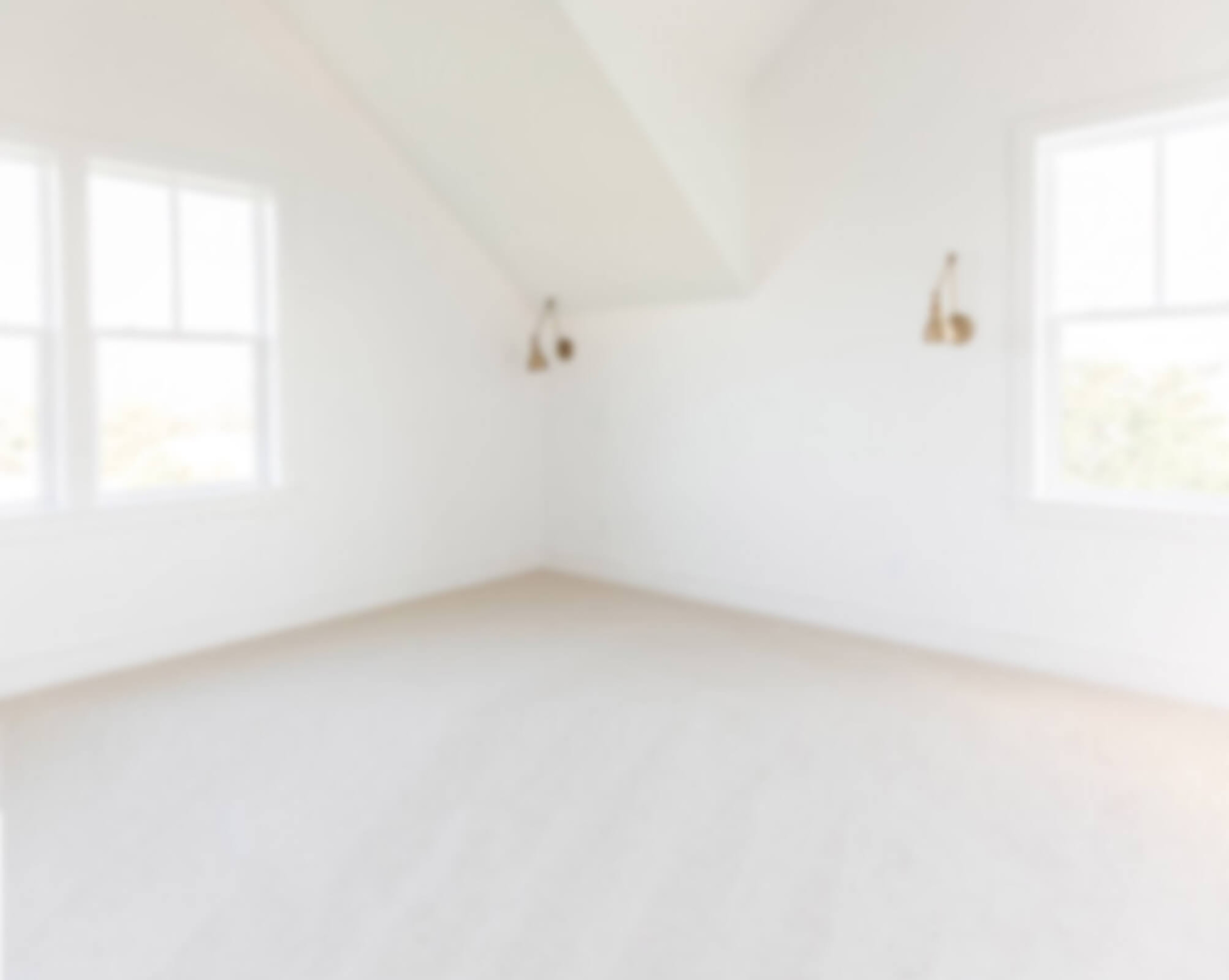 A blurry image of a white room
