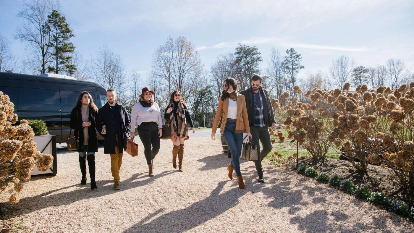 Wine tour with friends walking on path