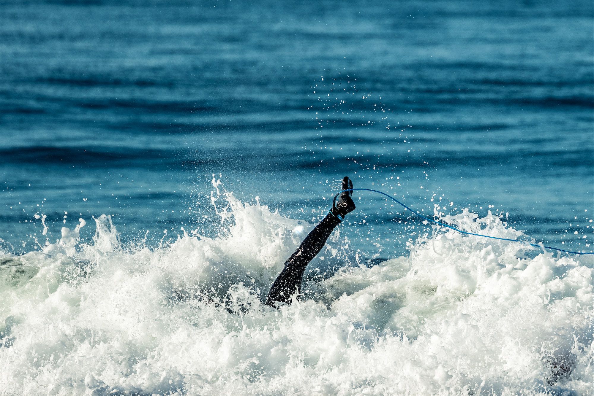 Ernie leg in the air surfing