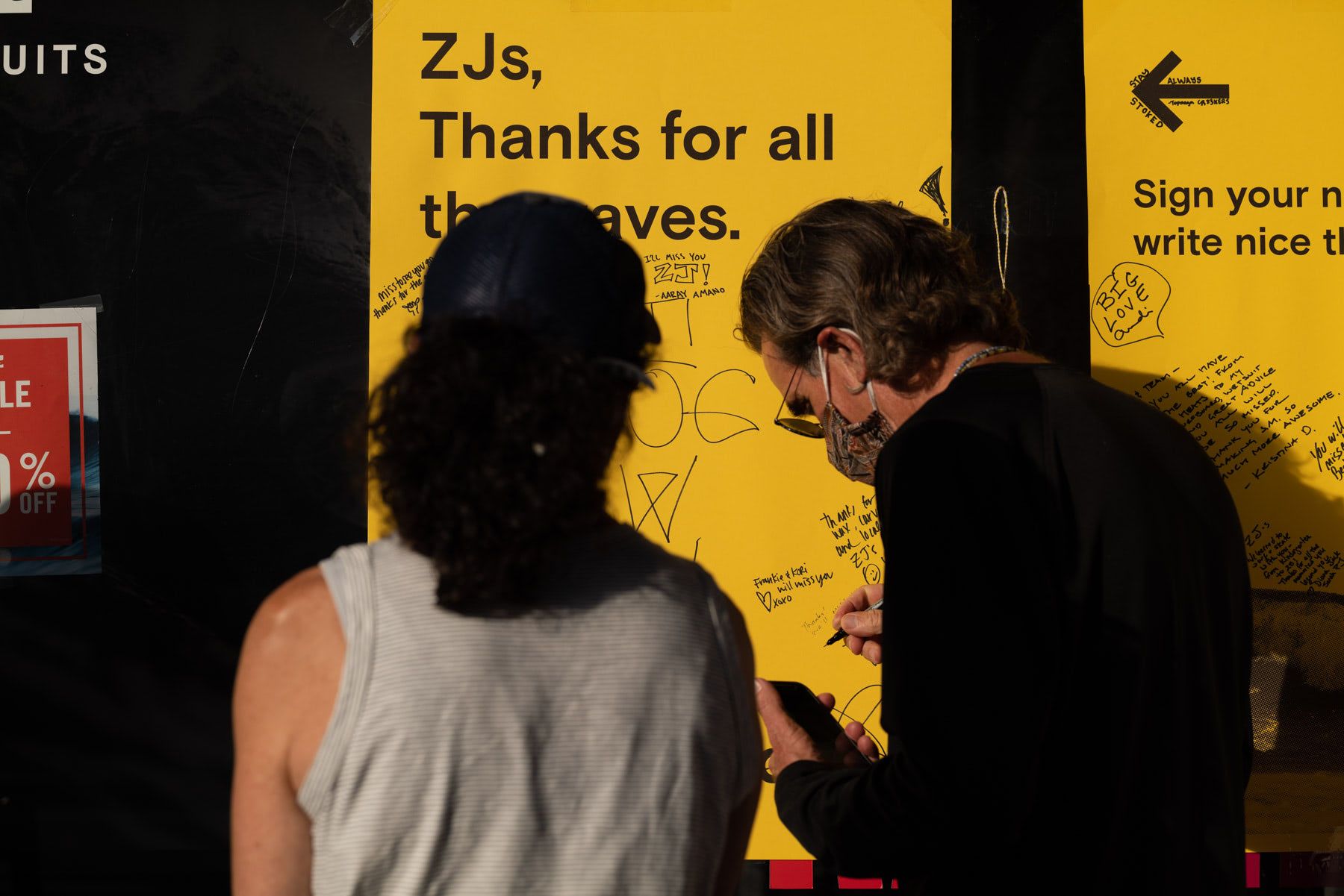 zjs boarding shop closing writing on poster