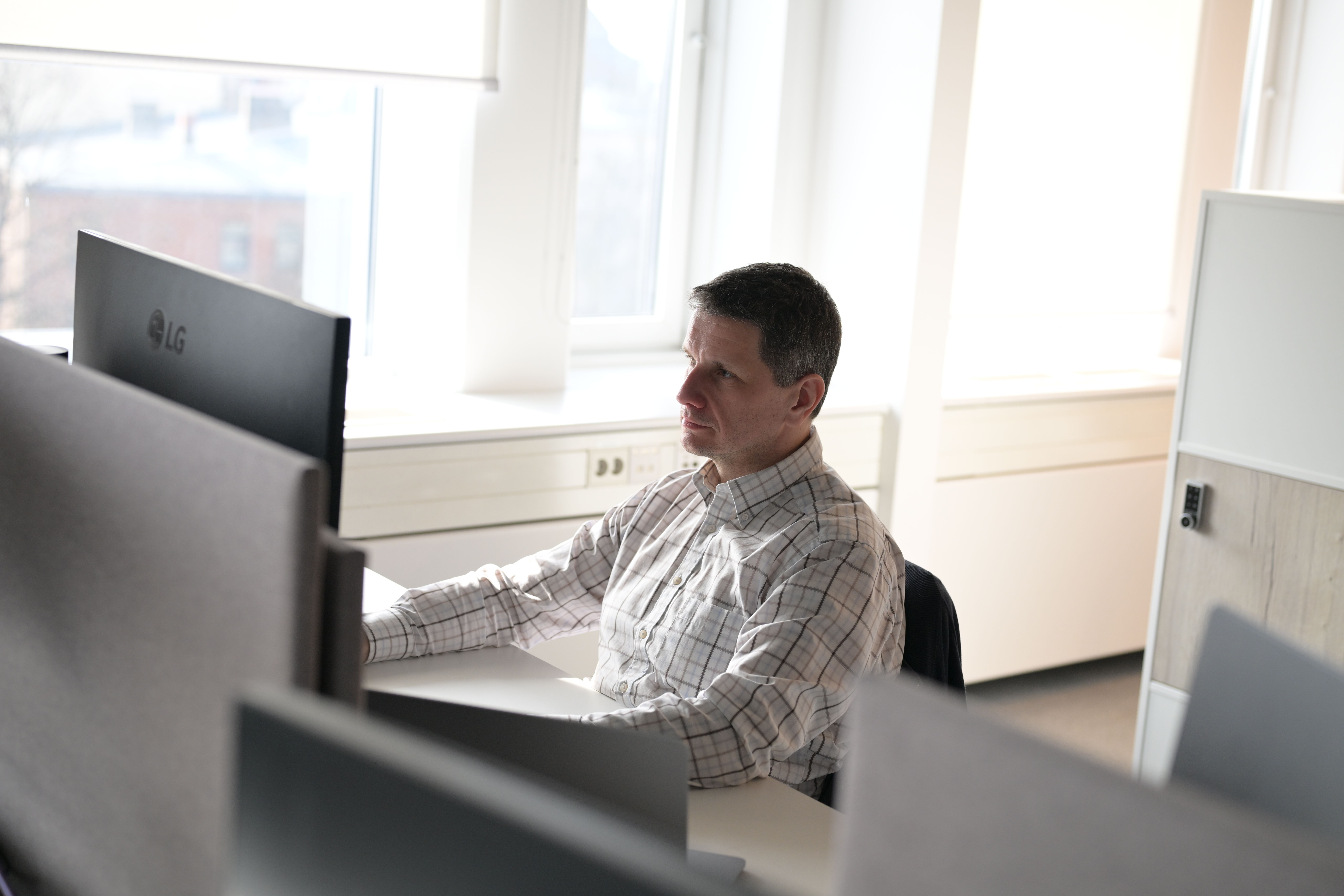 Man sitting in front of laptop working.