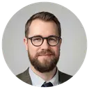 Man with a beard and glasses