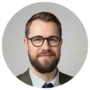 Man with a beard and glasses