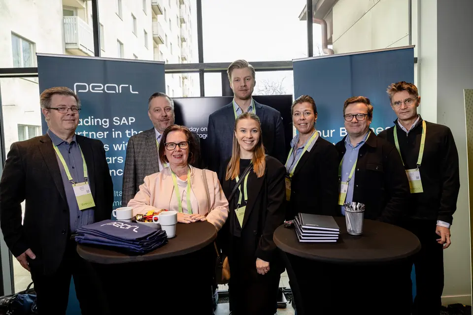 People standing in group at an event.