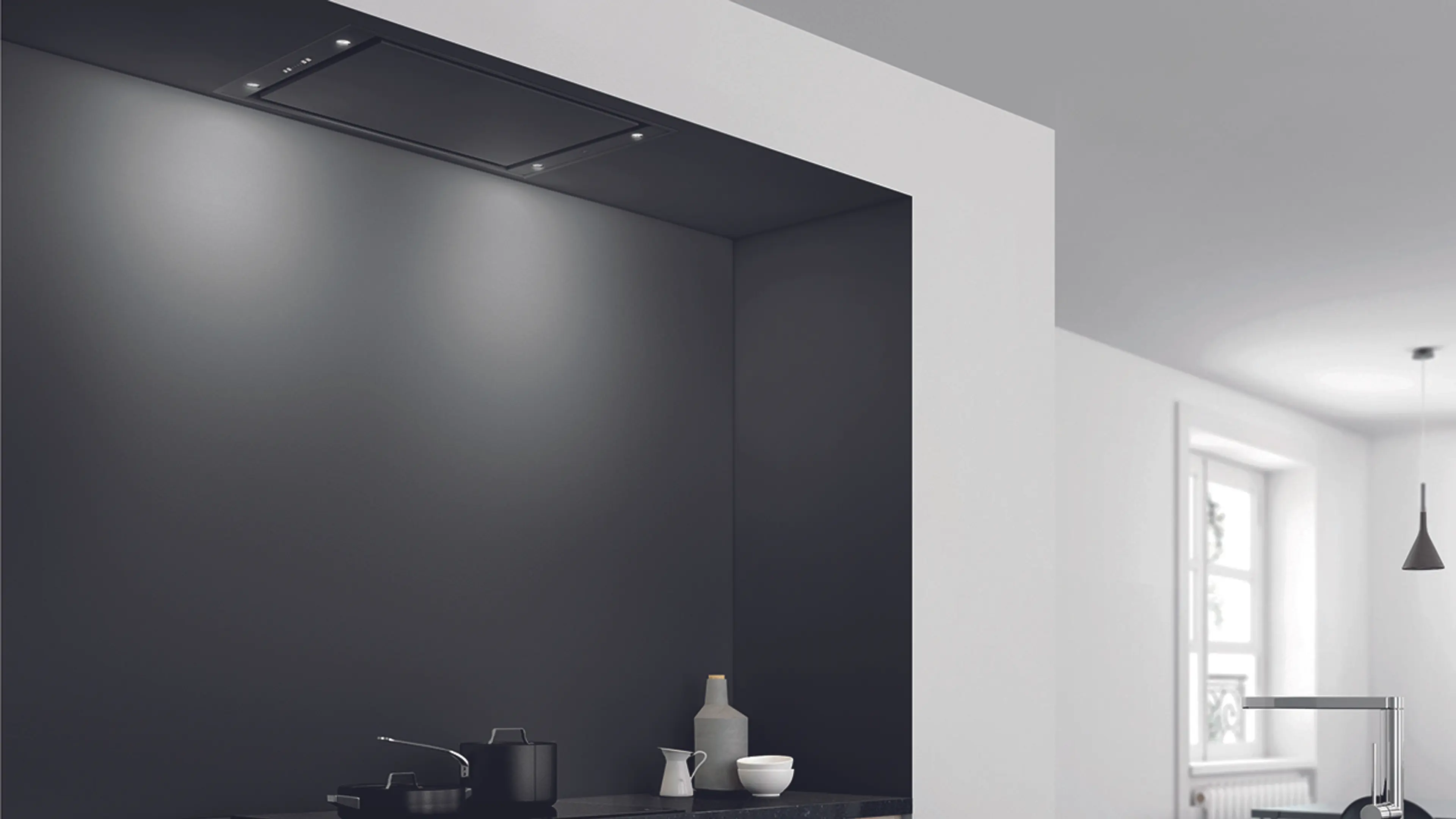 Svart RørosHetta Sky takmontert kjøkkenvifte i svart og hvitt kjøkken.