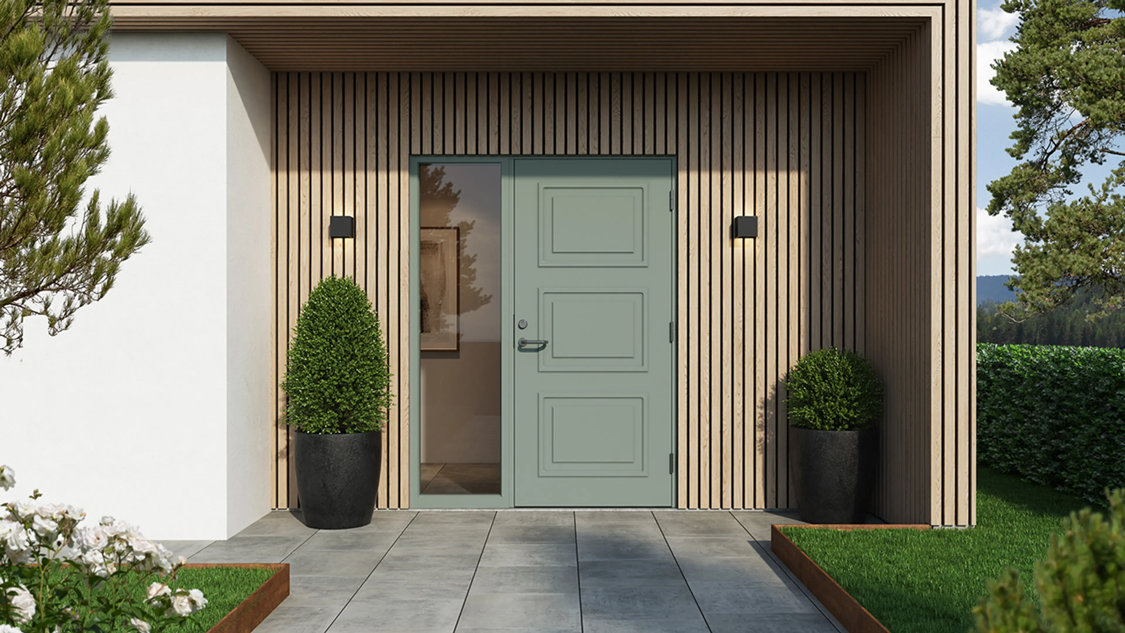 Moderne murhus med spilevegg og grønn ytterdør med sidefelt.