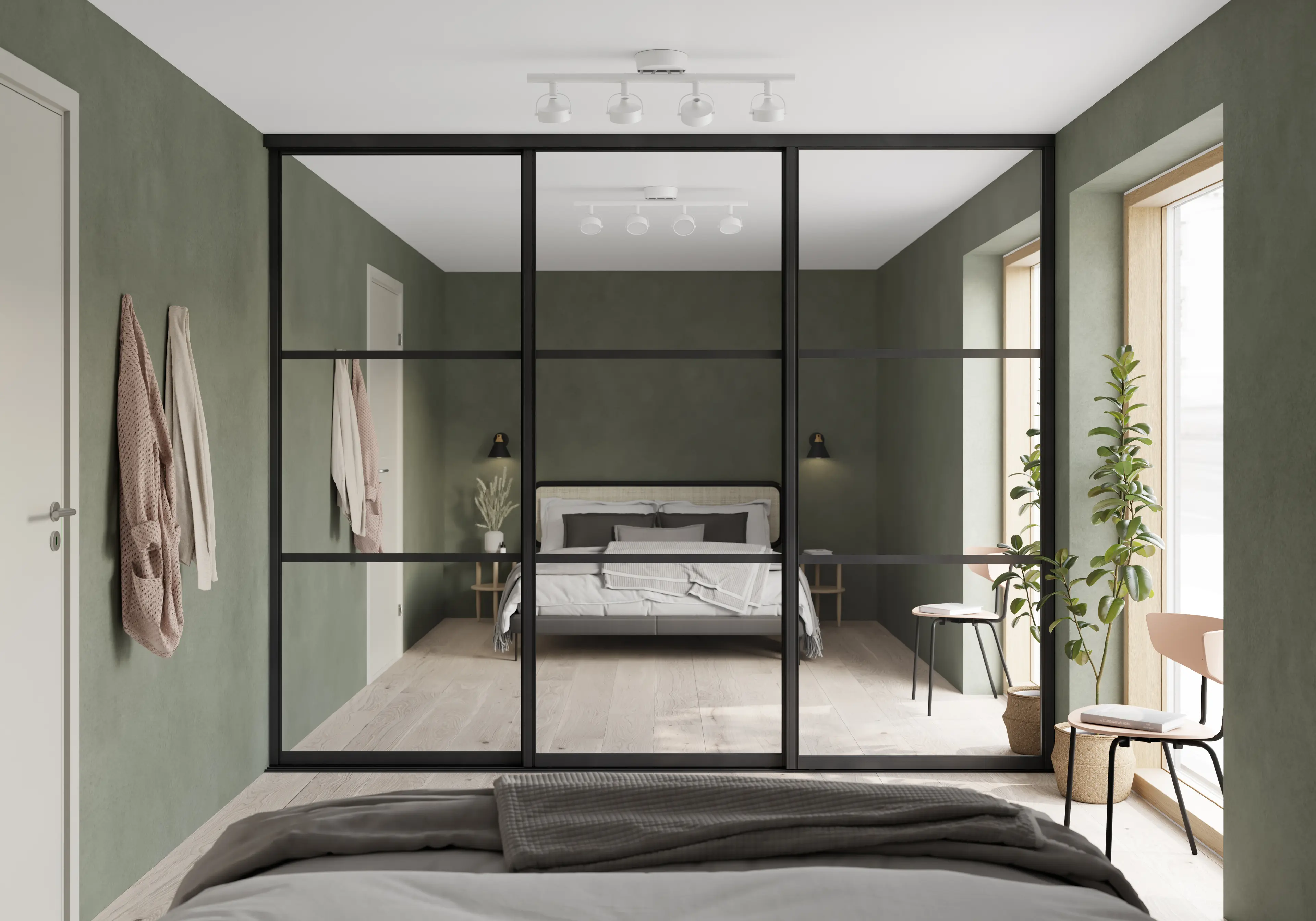 Skyvedørsgarderobe på soverom med grønne vegger