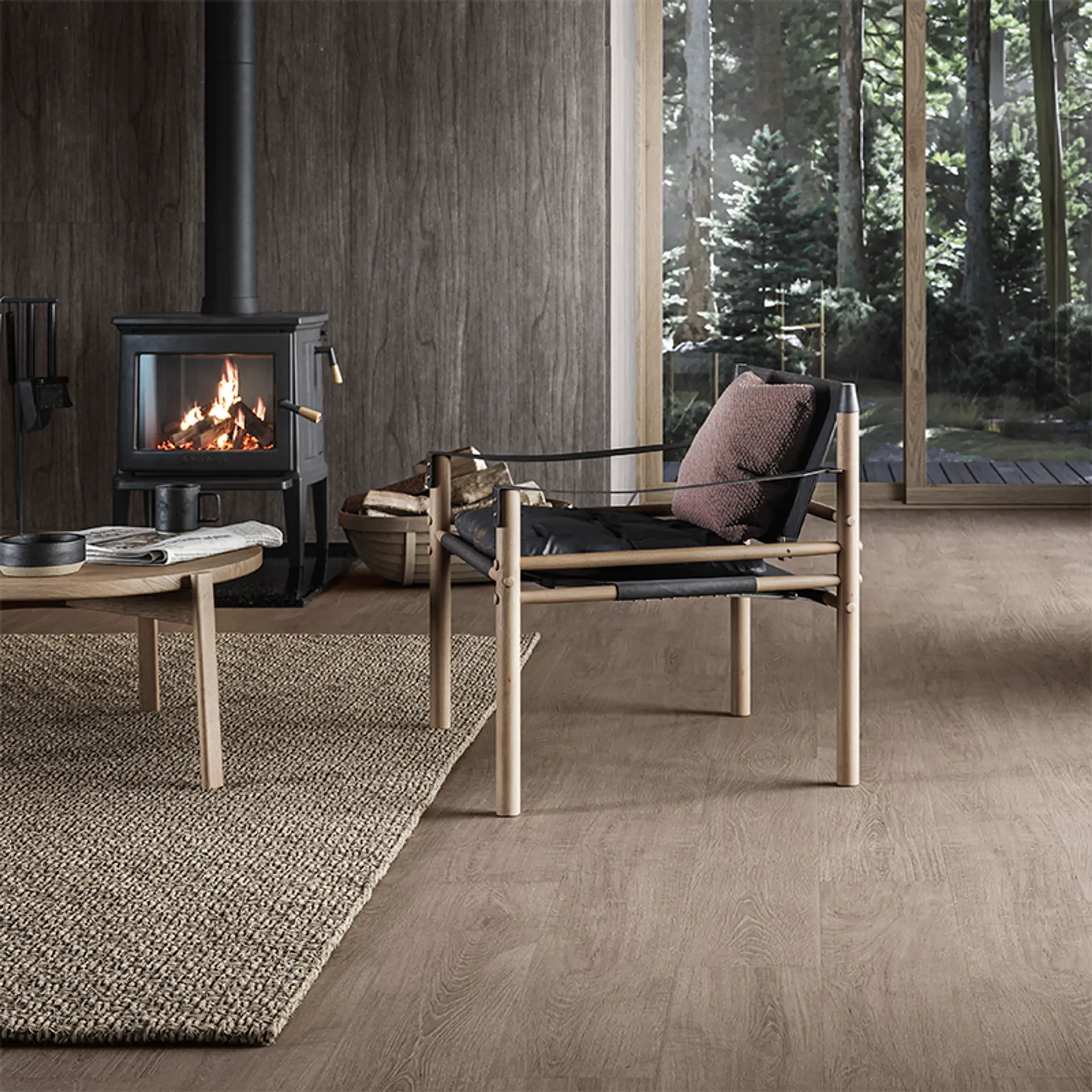 moderne hytte med mørkt gulv og møbler i skandinavisk design
