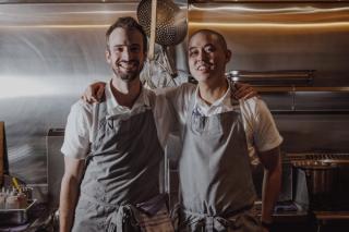 Chefs Ned Trumble & Keat Lee of Lagoon Dining standing in kitchen smiling