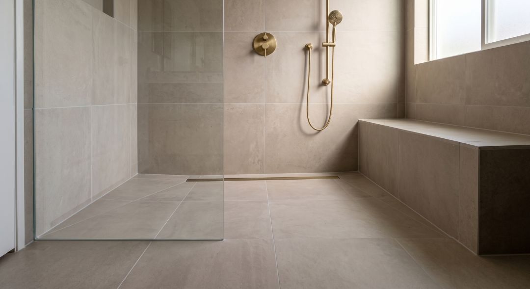 Curbless walk-in shower with large format porcelain tile and linear drain in a Thousand Oaks CA master bathroom