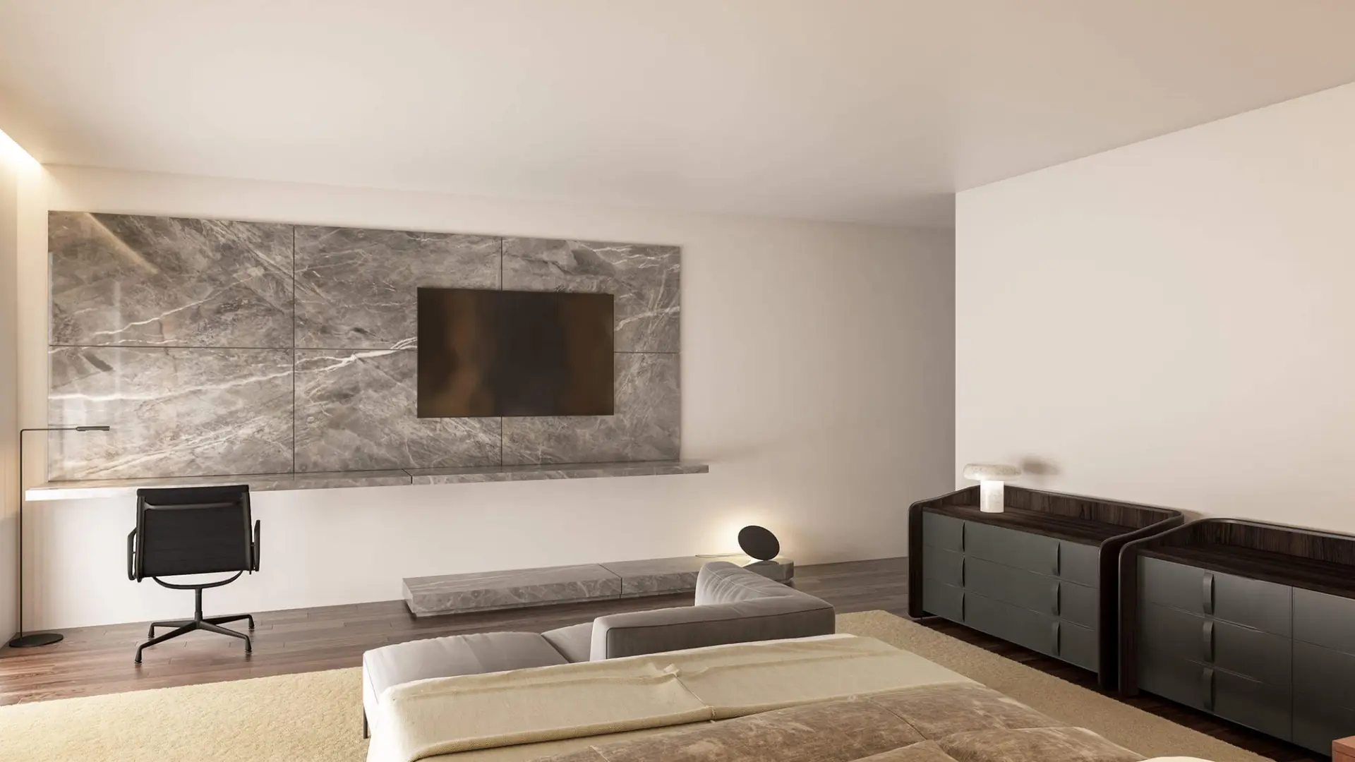 Grey marble feature wall with wall-mounted TV, floating desk and grey curved-edge chests — luxury master suite design