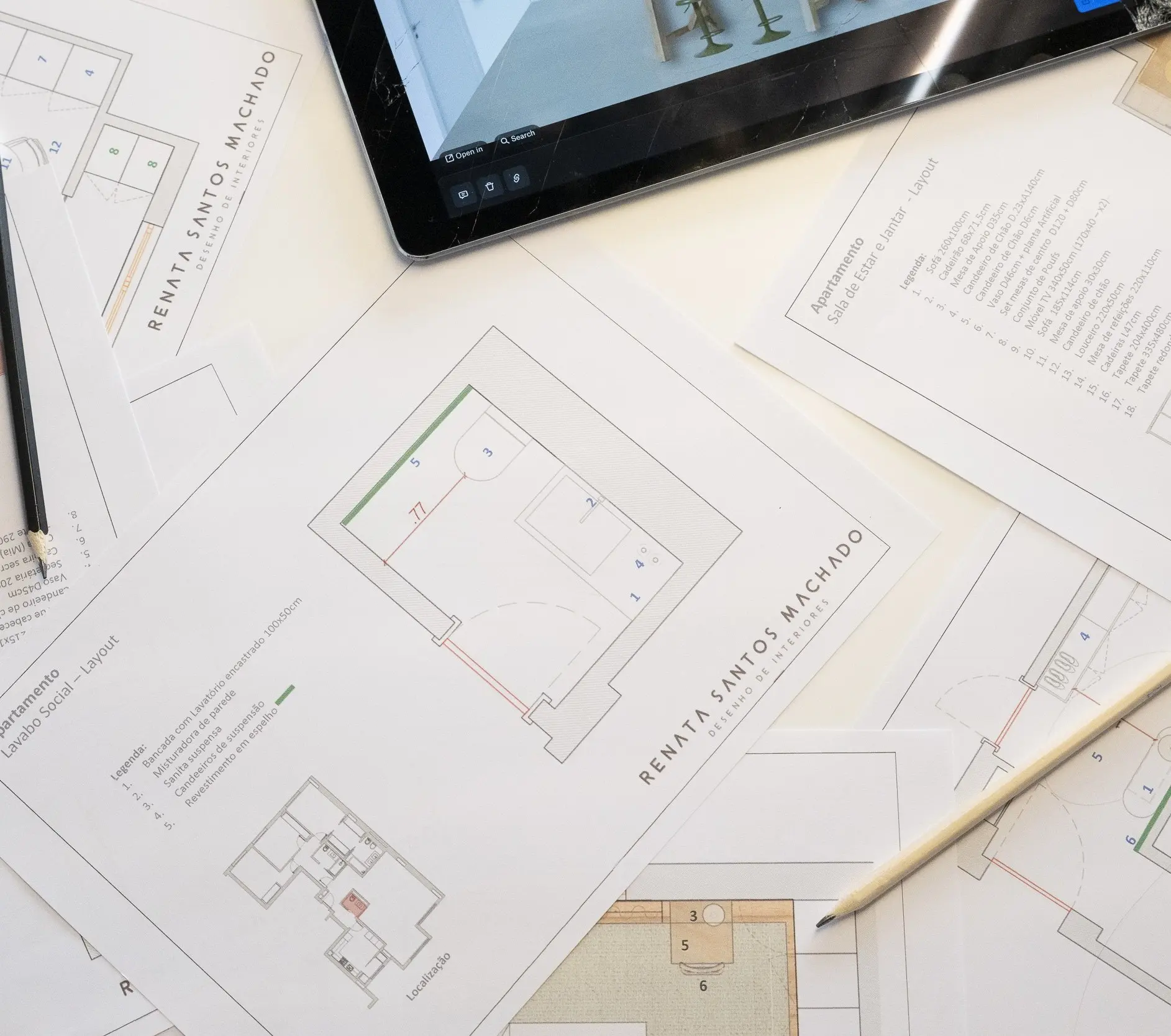 Technical floor plans and interior design project documents with tablet — design process at Atelier Renata Santos Machado, Lisbon