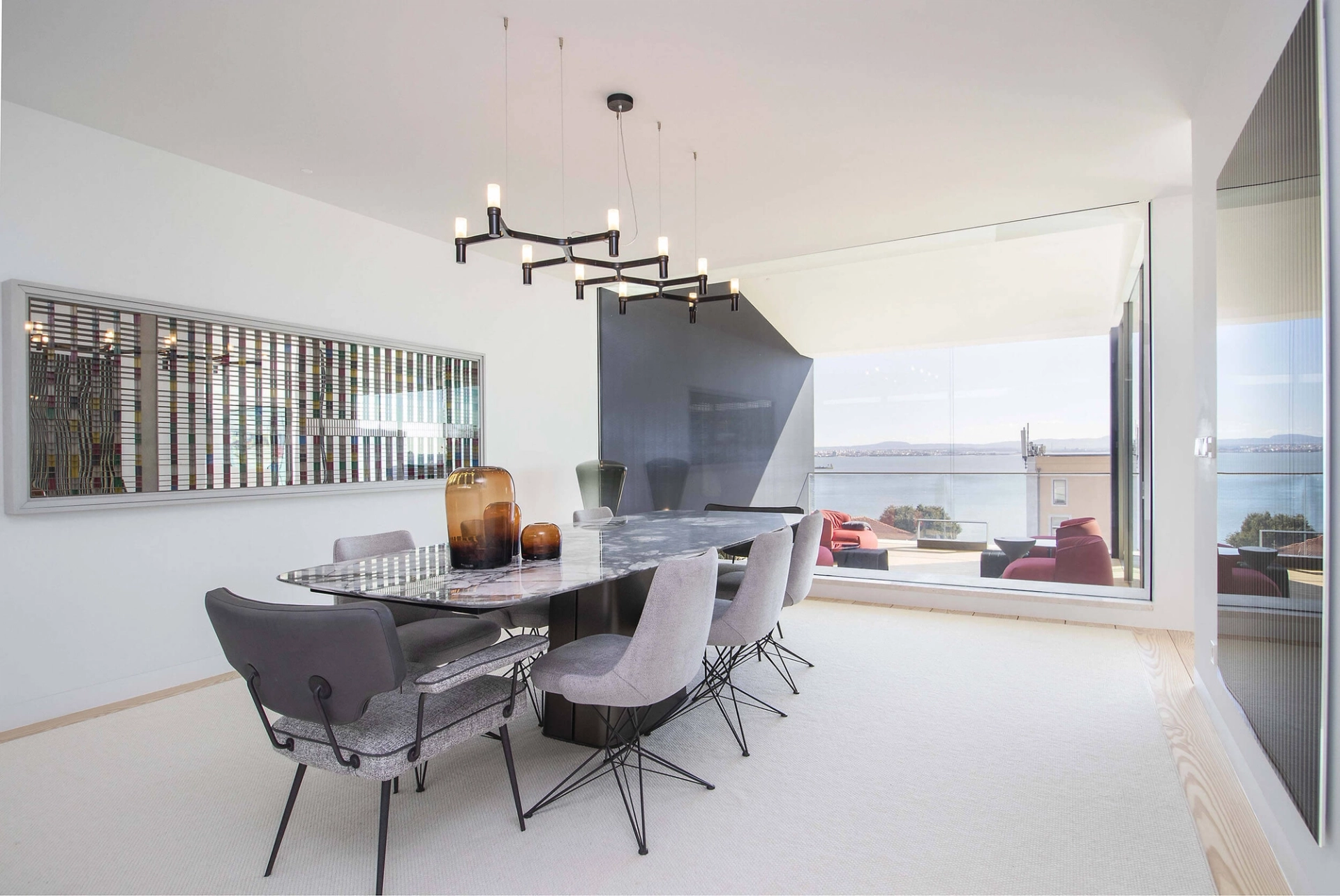 Dining room with Arketipo marble table and chairs, Rodrigo Oliveira artwork and Tagus River views — luxury interior design, Lisbon, Atelier Renata Santos Machado