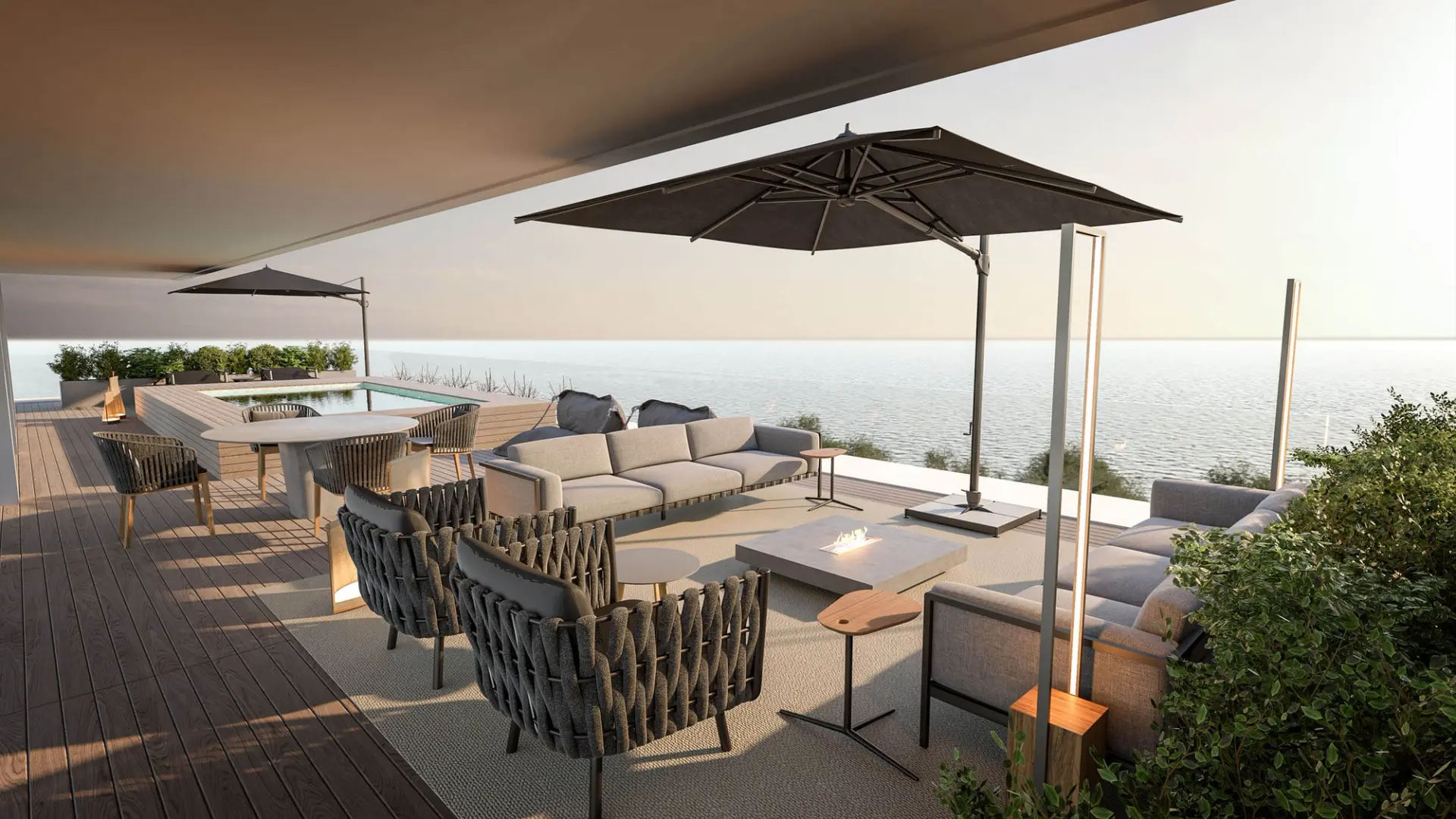 Outdoor terrace with sea view, cantilever parasol, rope seating and pool in the background — luxury interior design Lisbon